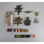 Collection of badges to include silver examples and a Ronson RAF lighter