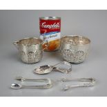 Hallmarked chased silver sugar bowl and cream jug together with silver spoon and 2 sugar nips -