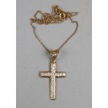 Gold diamond set crucifix on gold chain