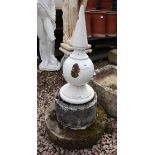 Cast iron finial on stone base