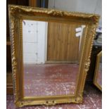 Bevelled glass mirror in gilt frame