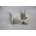 Pair of white metal fighting cockerels