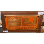 Byron Jackson brass plaque mounted on wood