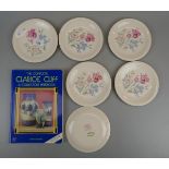 6 small Clarice Cliff plates together with a collectors book