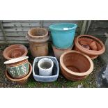 Large collection of terracotta planters to include chimney pot