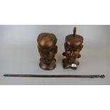 Pair of wooden tribal carvings togther with a carved stick