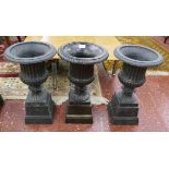 Set of 3 cast iron urns on plinths - Height 50cm