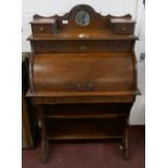 Oak roll fronted writing desk