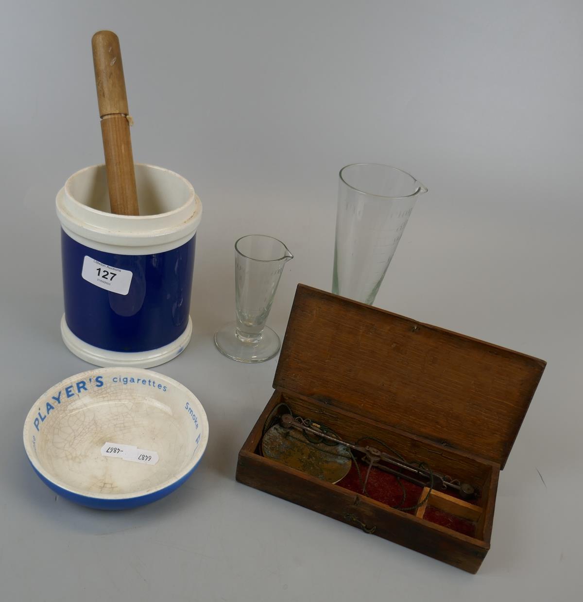 Scales, measuring jars, thermometer and ashtray.