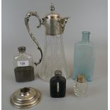 Collection of bottles together with a hallmarked silver candlestick and claret jug