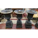 Set of 3 cast iron urns on plinths - Height 68cm