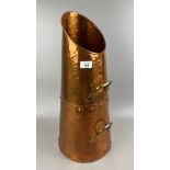 An Arts & Crafts style hand beaten copper coal scuttle