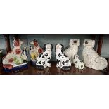 3 pairs of Staffordshire dogs with another
