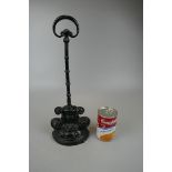 A 19th Century painted iron half round door stop with scrolls and panels