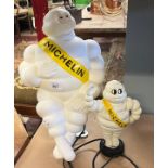 Cast iron Michelin man money box together with a Michelin man lamp