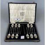 Cased silver teaspoons to include silver plate sugar nips