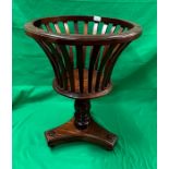 Edwardian style trumpet shaped mahogany jardinière on turned baluster stem with trefoil & ball feet