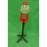 Vintage bubble gum machine on a cast iron base