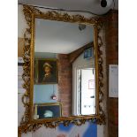 Ornate gilt framed bevelled glass mirror