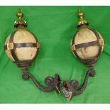 Pair of ornate wrought iron orb wall lights