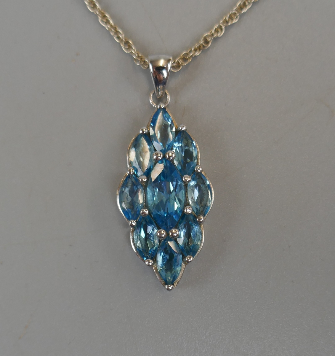 Silver blue topaz pendant on chain - Image 2 of 3