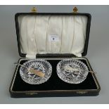 Cased condiment set 2 glass bowls with 2 hallmarked silver knives