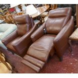 Pair of leather armchairs to include electric recliner with USB port