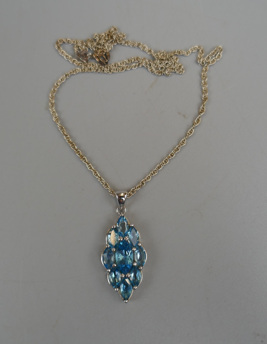 Silver blue topaz pendant on chain