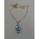 Silver blue topaz pendant on chain