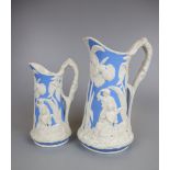 2 graduated T J & J Mayer Antique Victorian Moulded Parian Ware Jugs 'The Family' c1850