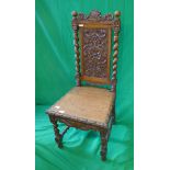 Carved oak barley-twist chair adorned with dragons