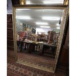 Large bevelled glass mirror in ornate gilt frame