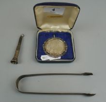 Hallmarked silver cigar cutter, sugar tongs and Marie Therese silver coin pendant