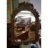 Ornate mirror adorned with cherubs