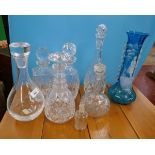 Collection of decanters together with a blue and white vase