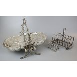 Silver plated biscuit tin in shape of clam together with 2 silver plate toast racks