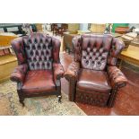 2 oxblood red leather armchairs