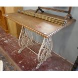 Small wooden table with cast iron base