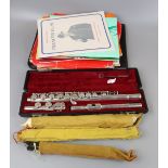 Flute together with recorder and music books