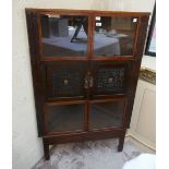Oriental themed corner cabinet with well carved panels