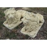 Pair of large stone reclining lions