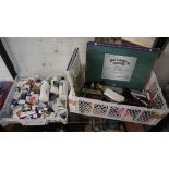 Collection of artists tools, paints and paper