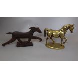 Brass horse figurine together with a metal horse figurine