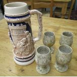 Four marble goblets together with large tankard