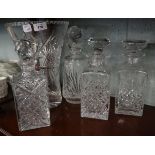 4 cut glass decanters together with large vase