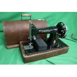Singer sewing machine together with a sewing table