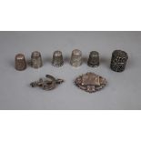 Collection of hallmarked silver to include thimbles and badge