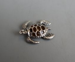 Silver and amber turtle pendant