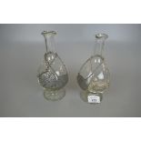 Pair of hand blown bottles to include 3 pewter and 1 silver plated bottle collars
