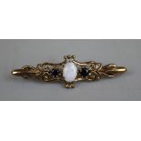 Gold bar brooch with opal and sapphires